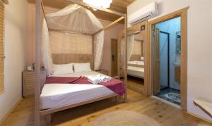 A bed or beds in a room at The Little Prince Boutique Otel