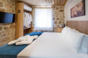 A bed or beds in a room at The Little Prince Boutique Otel