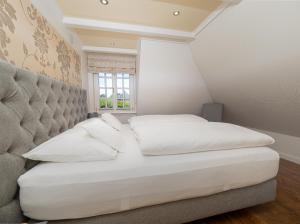 Postel nebo postele na pokoji v ubytování Südwind´s Hummerkoje