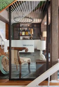 a display window of a living room with a chair at Herb Art Hotel in Keelung