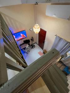 an overhead view of a room with a bed and a desk at Loft Baler with Kitchen & Ideal for Work from Home Setup in Baler