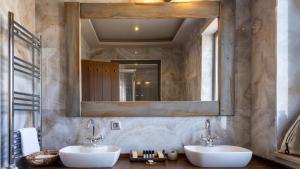 a bathroom with two sinks and a mirror at Nadas Kazdağları in Çanakkale +44 photos