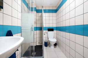 a bathroom with a toilet and a sink at El Refugio in Sardina +22 photos