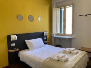 Postel nebo postele na pokoji v ubytování Il Piccolo Albergo Matera