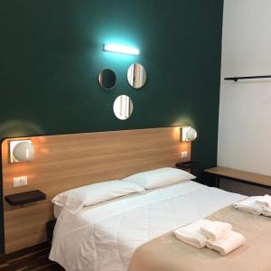 Postel nebo postele na pokoji v ubytování Il Piccolo Albergo Matera