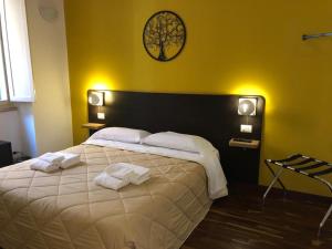 Postel nebo postele na pokoji v ubytování Il Piccolo Albergo Matera