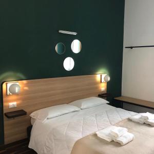 Postel nebo postele na pokoji v ubytování Il Piccolo Albergo Matera