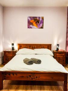 A bed or beds in a room at Gościna U kowala