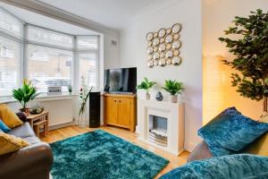 Et tv og/eller underholdning på Statera Apartments - 2-Bed House in Stratford