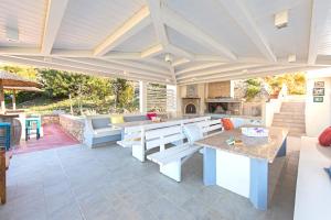 a kitchen area with a table and chairs at Renata's Villas in Karpathos