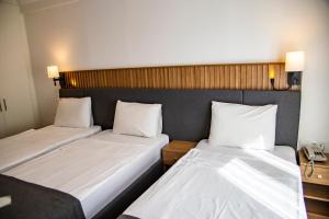 Postel nebo postele na pokoji v ubytování Silvana Hotel