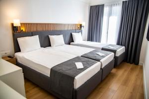 Postel nebo postele na pokoji v ubytování Silvana Hotel