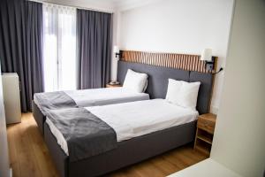 Postel nebo postele na pokoji v ubytování Silvana Hotel