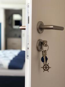 Postel nebo postele na pokoji v ubytování Gästehaus Arkona