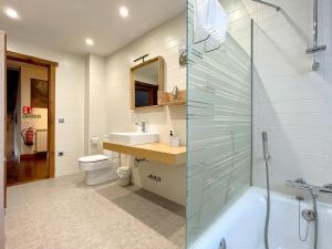 a bathroom with a glass shower and a sink at CASA RURAL ERVITENA in Oteiza +6 photos