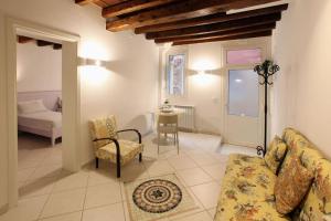 A bed or beds in a room at Ca' de l'Anzolo