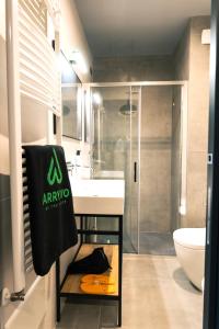 a bathroom with a sink and a shower at Arryvo Hotel in Lecce