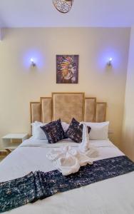 Postel nebo postele na pokoji v ubytování Luxury 1Br Apartment with Secure Parking & Lift Nakuru