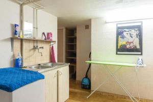 a kitchen with a sink and a counter top at Villa Lou Gecko in Hyères