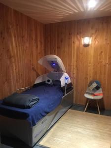 Postel nebo postele na pokoji v ubytování Le Volcan des Sens, chambres d'hotes de luxe et SPA privatif
