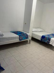 Voodi või voodid majutusasutuse Hotel Palma Azul Beach toas
