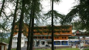 a large building with trees in front of it at Adonis Valberg in Valberg