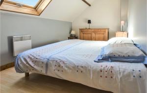 a bedroom with a large bed with a white comforter at Amazing Home In Bonneville-La-Louvet in Bonneville-la-Louvet