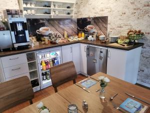 Kuchyň nebo kuchyňský kout v ubytování Gästehaus Arkona