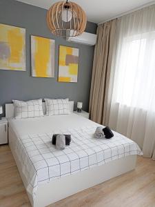 Säng eller sängar i ett rum på Apartment SEA HOLIDAYS