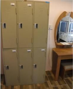 a group of lockers in a room with a mirror at Seashell Resort Koh Tao-SHA Plus in Ko Tao