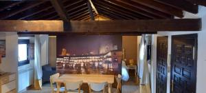 a dining room with a table and chairs at Casas Recuero in Chinchón