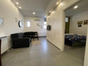 Uma área de estar em TEPIĆ Garni Hotel