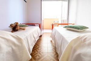 A bed or beds in a room at Residence Rainbow
