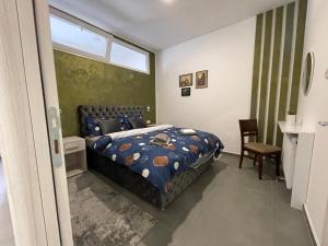 Uma cama ou camas num quarto em TEPIĆ Garni Hotel