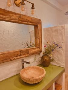 a bathroom with a sink and a mirror at Domek Polny in Strachów