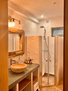 a bathroom with a sink and a shower at Domek Polny in Strachów