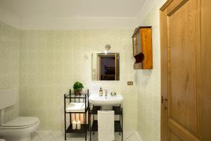 a bathroom with a sink and a toilet at Buccia Nera in Chiassa Superiore