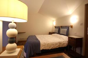 Кровать или кровати в номере Chez marie