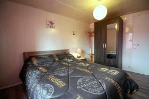 Ένα ή περισσότερα κρεβάτια σε δωμάτιο στο La guinandie