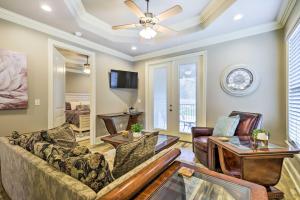 a living room with a couch and a table at Diamondhead Condo - Marina, Pool Access and Golfing! in Diamondhead