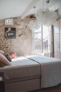 Posteľ alebo postele v izbe v ubytovaní Appartement 26 Arles centre