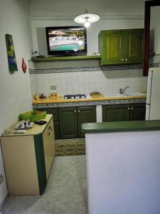 Virtuvė arba virtuvėlė apgyvendinimo įstaigoje Casa Assuntina