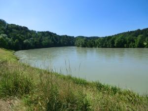 a large body of water with trees in the background at Urlaub am Inn in Wasserburg am Inn