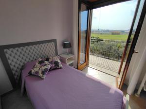 A bed or beds in a room at Il Giardino delle Zagare