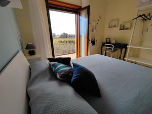 Postel nebo postele na pokoji v ubytování Il Giardino delle Zagare
