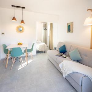 a living room with a couch and a table at Résidence Pierre et Vacances Cap Cassis Calanques in Roquefort-la-Bédoule