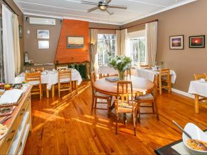 a dining room with a table and chairs at Gumtree Guest House in Oudtshoorn