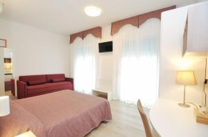Postel nebo postele na pokoji v ubytování Hotel Da Mario