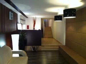 Телевизор и/или развлекательный центр в Apartments and Rooms Grand Palazzo