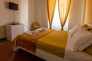 Postel nebo postele na pokoji v ubytování Granello Suite Central